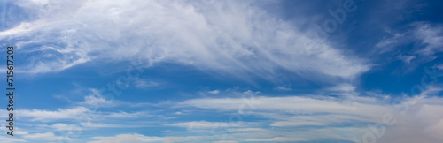 Blue sky with light airy white cirrus clouds for background
