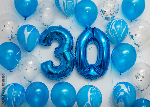 Foto Blue number 30 celebration foil balloons with helium balloons on white background