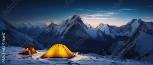 Panorama of Steep peak mountains with covered snow and yellow tent camping at twilight time.