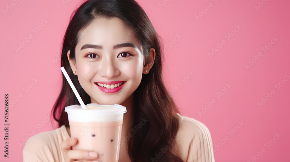 Cheerful asian woman drink ice cocoa with straw thirsty refreshment looking camera on pink background. Portrait excited girl holding ice beverage in cup plastic use straw drinking relax over isolated. Cheerful asian woman drink ice cocoa with straw thirsty refreshment looking camera on pink background. Portrait excited girl holding ice beverage in cup plastic use straw drinking relax over isolated.