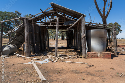 A broken down farm shed in a dry paddock at Campbells, Forest in Central Victoria. photo