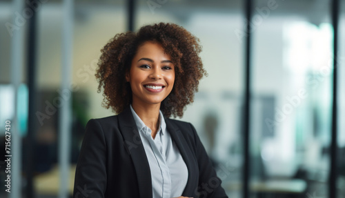 Smiling African American businesswoman in modern office space