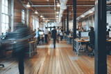 blurry image of many people in a office.