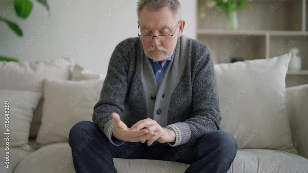 Hands of man holding stones to calm. Pensioner shifts anti-stress stones on hand palm. Soothing practices to stabilize nervous system. Method of solution psychological problems, anti-neurotism. Hands of man holding stones to calm. Pensioner shifts anti-stress stones on hand palm. Soothing practices to stabilize nervous system. Method of solution psychological problems, anti-neurotism.