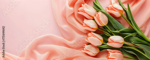 Flat lay banner with bouquet of peach tulips on a peach fuzz fabric. Spring greeting card with peach fuzz copy space. World Womens Day, March 8, Mothers day, Valentines Day, Wedding. #715644642