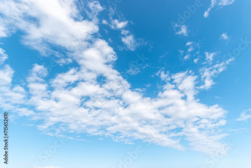 Blue sky background with white clouds. Nature background.