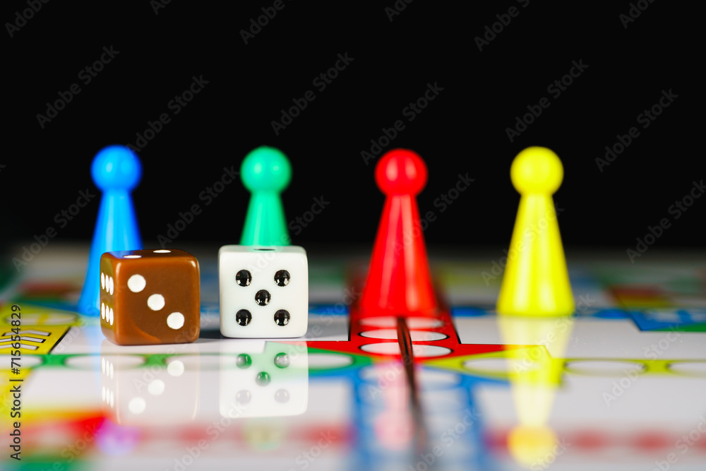 Close up dice on board game using for education and business strategy concept Close up dice on board game using for education and business strategy concept