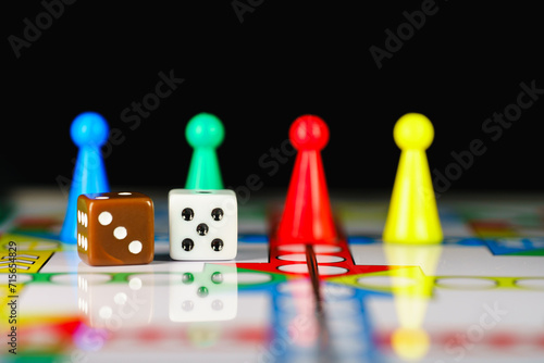 Close up dice on board game using for education and business strategy concept