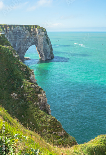 overlook the Elephant like white sea cliff with sapphire blue sea in Étretat
