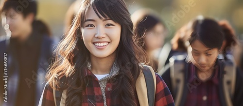 female student smiling happy campus background