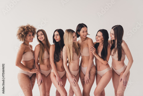 No filter photo of joyful feminist girls with diverse body type support love imperfections isolated pastel color background