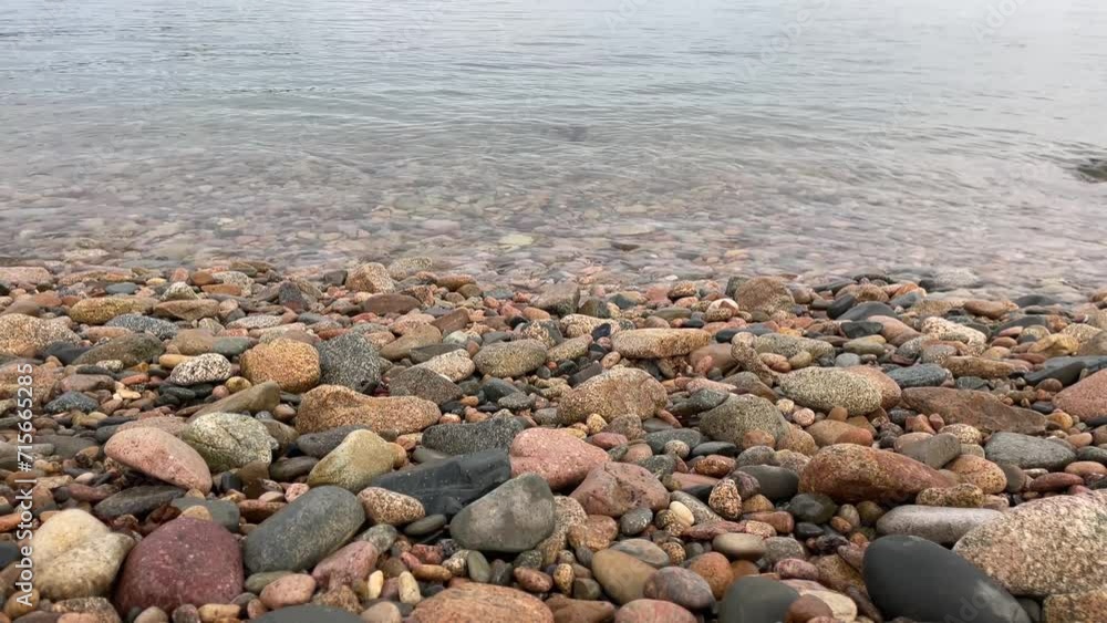 close up of stone beach with water waving close up of stone beach with water waving
