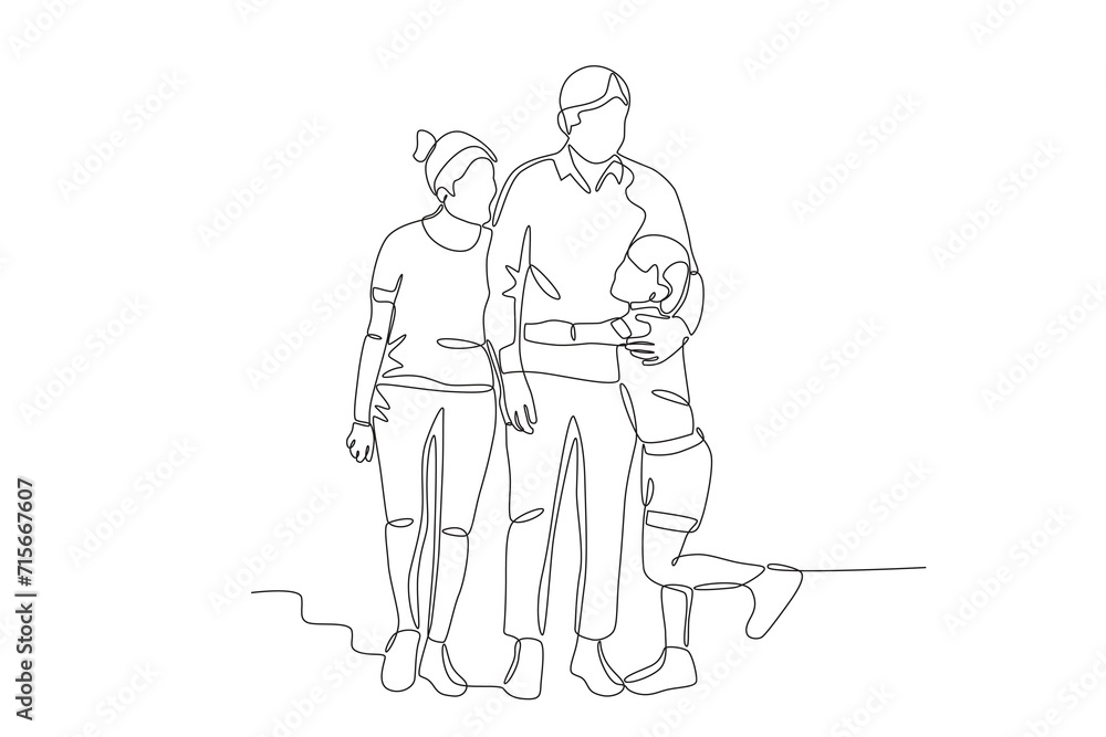 A boy hugging his father