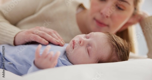 Family, love and a mama on the bed with her baby for sleep, rest or bonding together in a home. Children, bedroom and a single mom in an apartment with her newborn infant to relax for care or growth