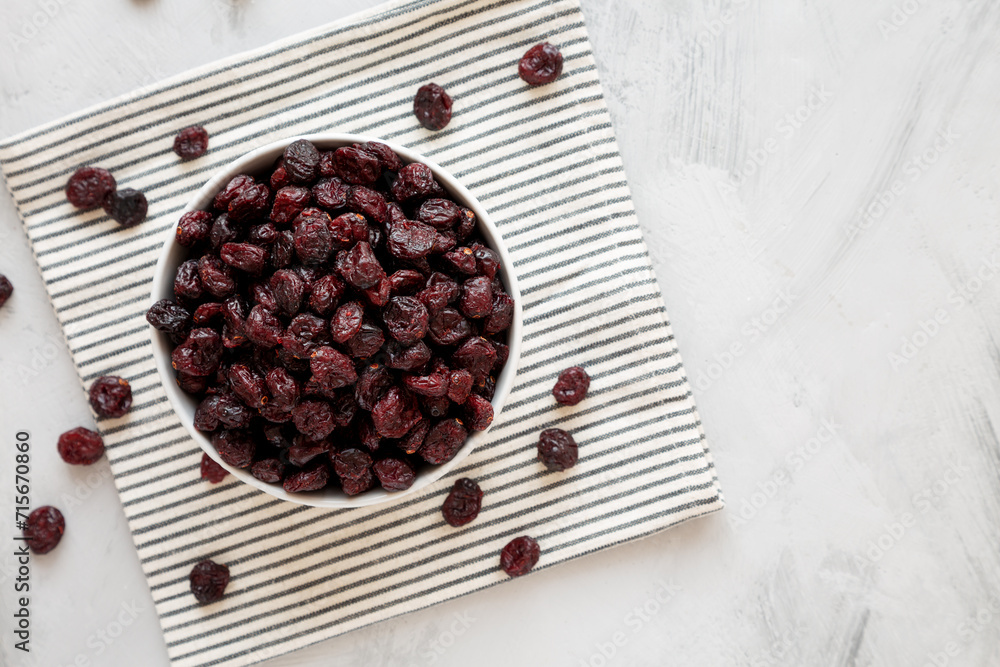 Organic Dried Cranberries in a Bowl, top view. Copy space. Organic Dried Cranberries in a Bowl, top view. Copy space.