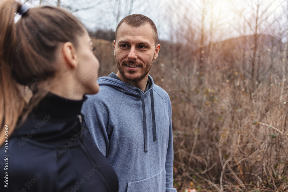 Obraz premium Cropped shot of two athletes standing outdoors. Portrait of a happy young couple out for a run.
