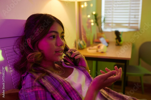 Teenage girl calling best friend to discuss news