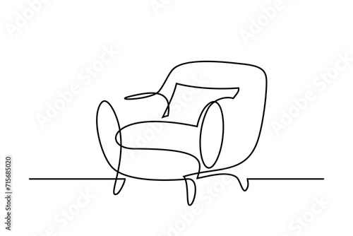 Armchair in continuous line art drawing style. Upholstered armchair with a pillow black linear sketch isolated on white background. Vector illustration photo