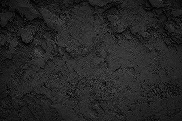 Black or dark gray rough grainy stone or sand plaster texture background