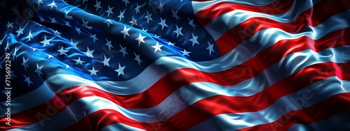 The American flag is shown with a silky texture, its stars and stripes flowing elegantly, symbolizing the nation's values of freedom and democracy. photo