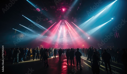 A sea of people bathed in blinding light, as laser beams cut through the air, creating a surreal atmosphere at the outdoor concert event © Larisa AI