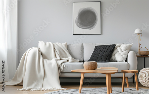 Interior of the living room. Furnished with a sofa, table, vase, and houseplants. Modern and minimalist style interior photo