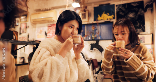 Photography Japanese friends, cheers and coffee in restaurant for dinner, vacation and hot drinks to celebrate on holiday