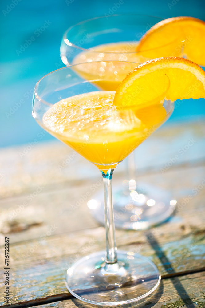 Champagne glasses with orange slice Mimosa cocktail Champagne glasses with orange slice Mimosa cocktail