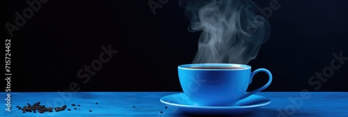 Blue Coffee Cup on Black Background. Aroma of Espresso in Shop Interior with Artsy Flair photo
