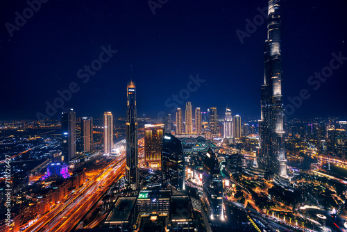 Photographie Aerial top view Dubai, night amazing skyline cityscape with illuminated skyscrapers, neon color