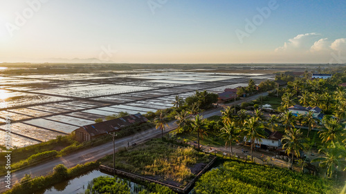 Fényképezés Photo en drone du couché de soleil sur les marais salant, kampot island, Kampot,