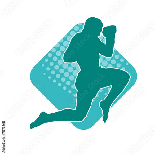 Silhouette of a kickboxer athlete in action pose. Silhouette of a sporty man doing kicking pose.