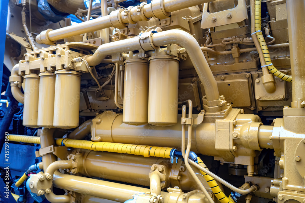 Industrial engine. Fragment of marine vessel motor. Diesel engine close up. Equipment for ship. Diesel engine for motor boat. Concept for maintenance of ship equipment. Industrial technology Industrial engine. Fragment of marine vessel motor. Diesel engine close up. Equipment for ship. Diesel engine for motor boat. Concept for maintenance of ship equipment. Industrial technology