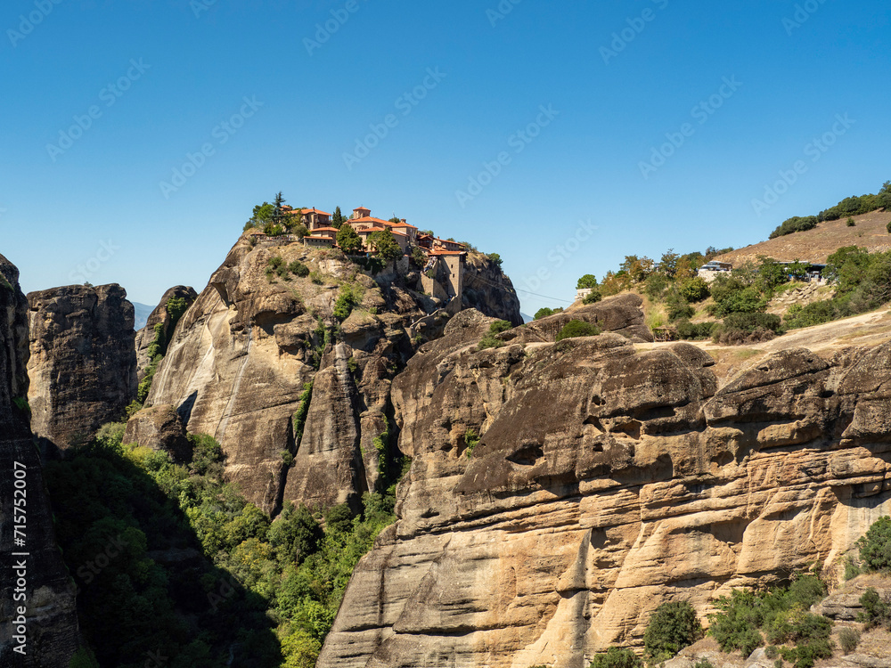 rock in the mountains, Panoramic view of Meteora monastery on the high rock and road in the mountains, Greece