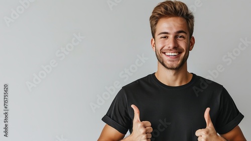 Portrait of an American man in black t shirt showing thumbs up with hand against a clean white backdrop with copy space, Generative AI. photo