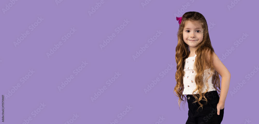 In the photo, a beautiful girl with blond and wavy hair is captured with the minutes in her pockets and with an attractive smile, she can be used for beauty banners and not only etc.