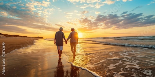 A joyful elderly couple walking on the beach enjoying a leisurely sunset