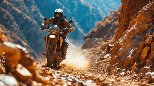 Motorcyclist riding on a dirt road in Himalaya mountains. Motocross. Enduro. Extreme sport concept.