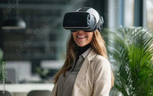 Smiling businesswoman in casual wear dons a VR helmet.