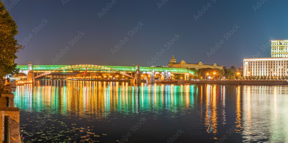Pushkinskiy bridge with night illumination. Bridge to Gorky Park. Pushkinskiy bridge with night illumination. Bridge to Gorky Park.