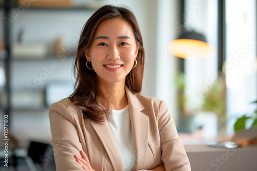 Happy confident business asianwoman in office looking at camera. technologist job concept