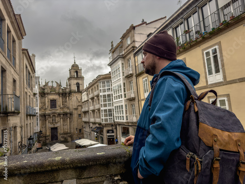 Contemplative Solo Traveler Overlooking Historic Cityscape