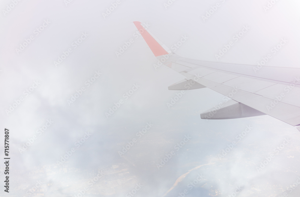View from the airplane window during taking off on a clear summer morning View from the airplane window during taking off on a clear summer morning