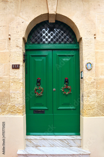 Wooden green door in downtown of Sliema, Malta © Lindasky76