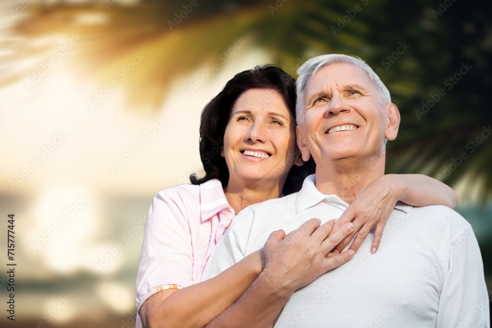 Happy senior couple have fun at the beach at vacation Happy senior couple have fun at the beach at vacation