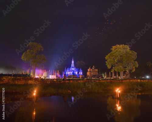 Sukhothai Historical Park festival, buddha pagoda stupa in a temple, Sukhothai, Thailand. Thai buddhist temple architecture at night. Tourist attraction.