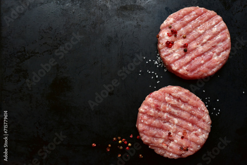 Meat burgers with ingredients for cooking. Top view with copy space. photo