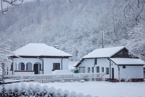 Winter landscape with a renovated traditional Romanian old house.