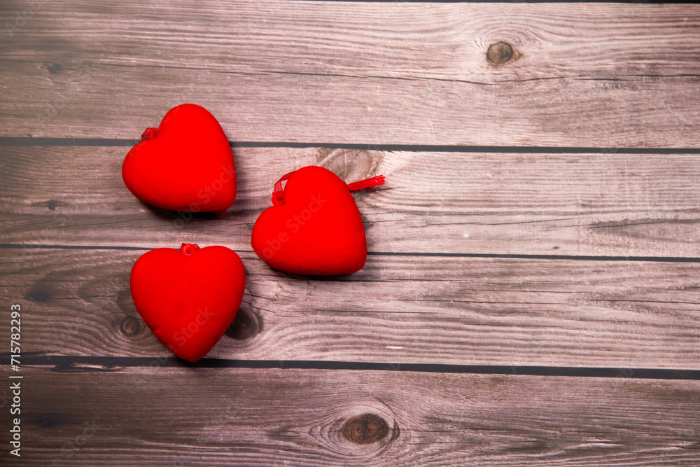 red hearts on wooden background red hearts on wooden background