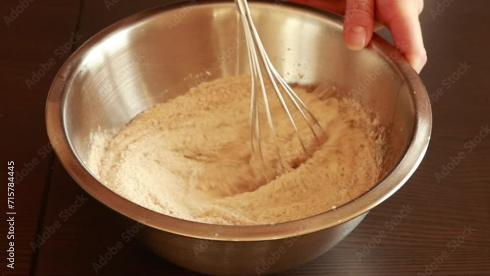 mixing dry ingredients for baking in a glass bowl close-up mixing dry ingredients for baking in a glass bowl close-up